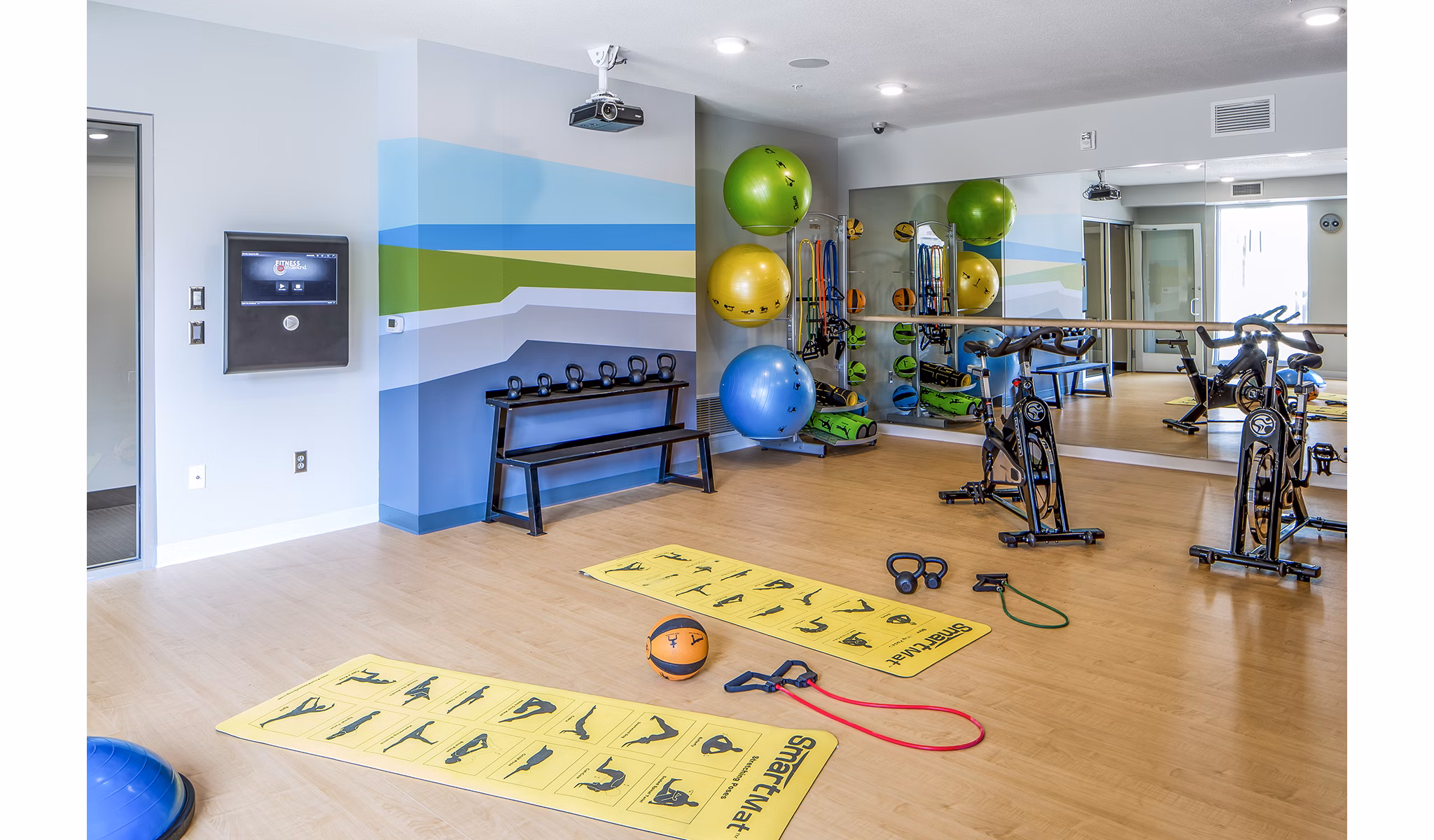 Yoga/spin studio featuring advanced equipment at Velo Apartments