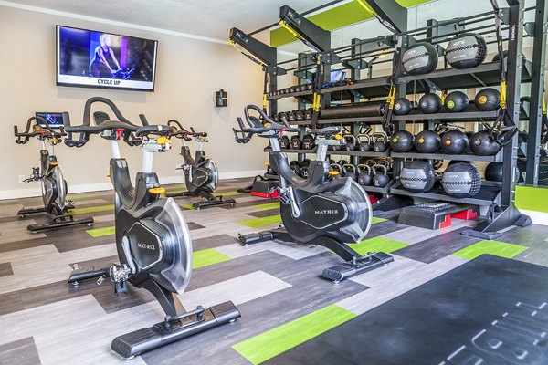 Yoga and spin studio with modern equipment at Spring Park Apartments for a healthy lifestyle