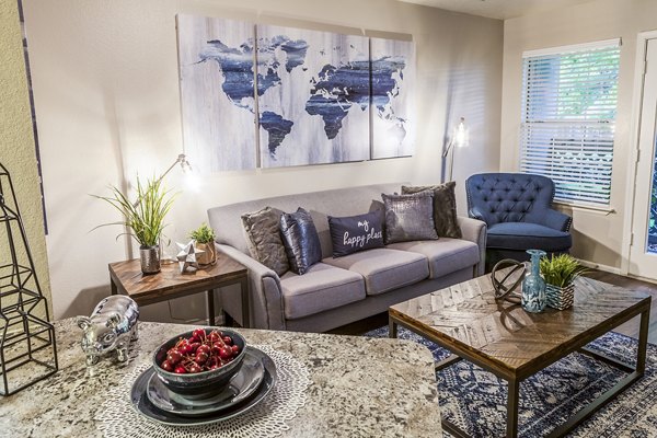 Spacious living room with modern decor and natural light at Spring Park Apartments