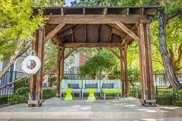 Spacious pool patio with lounge seating at Spring Park Apartments