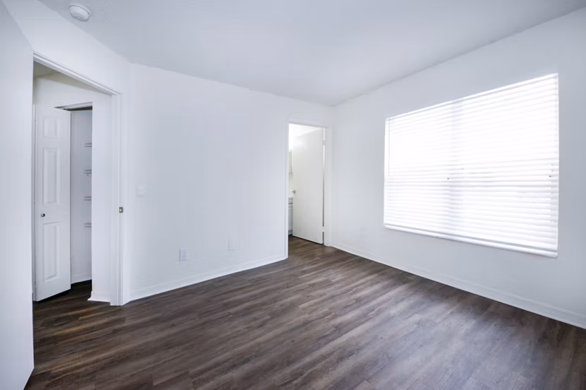 Cozy bedroom with stylish decor at Mira Flores Apartments