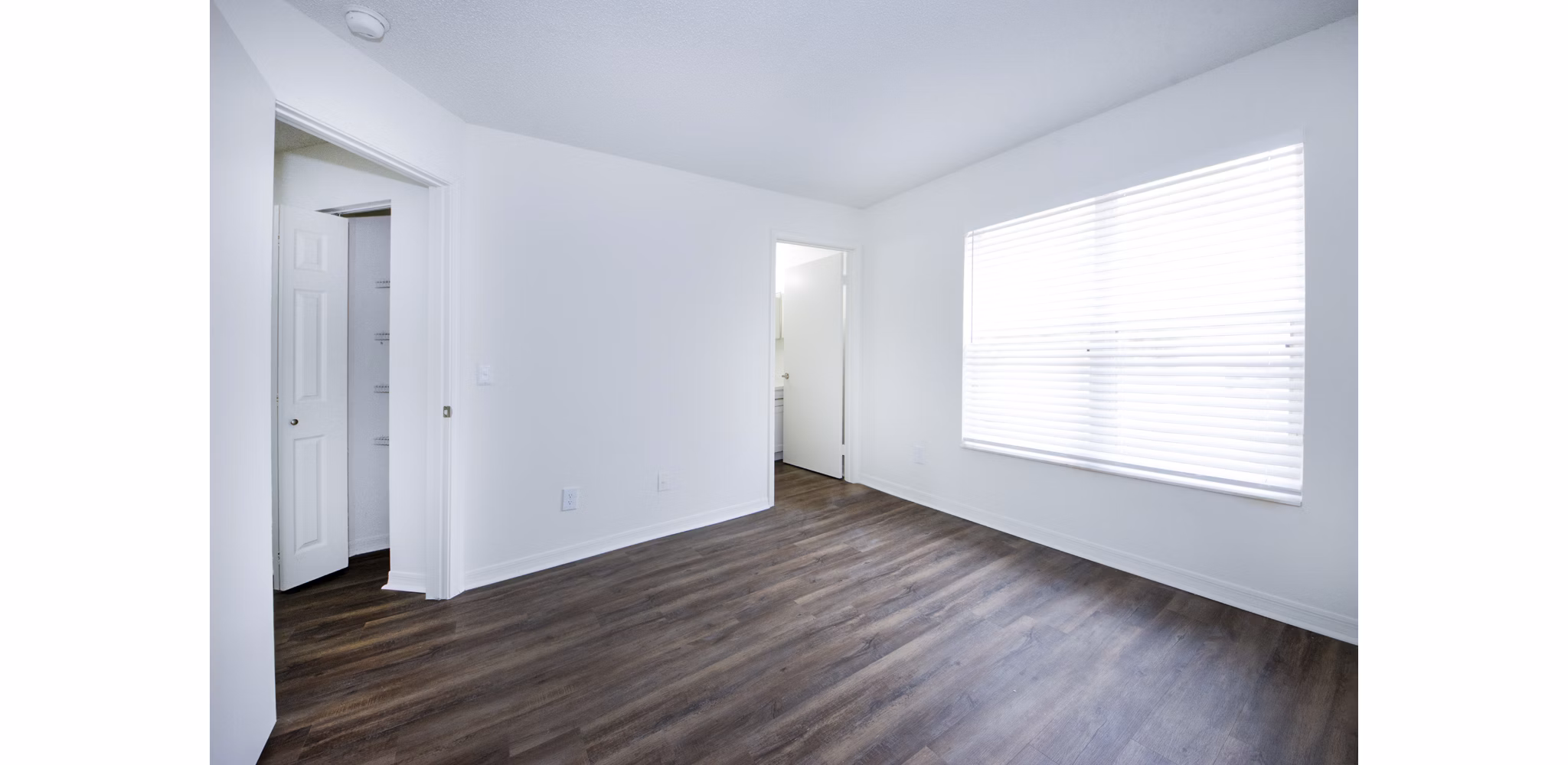 Cozy bedroom with stylish decor at Mira Flores Apartments