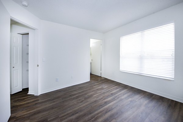 Cozy bedroom with stylish decor at Mira Flores Apartments