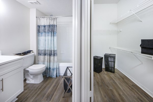 Cozy bedroom with modern decor at Mira Flores Apartments, luxury living in Paml Beach Gardens, FL.