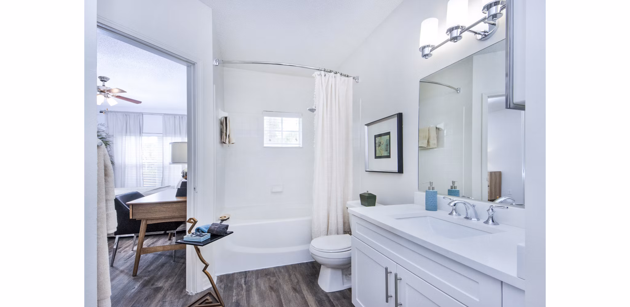 Cozy bedroom with modern dÃ©cor and natural light at Mira Flores Apartments