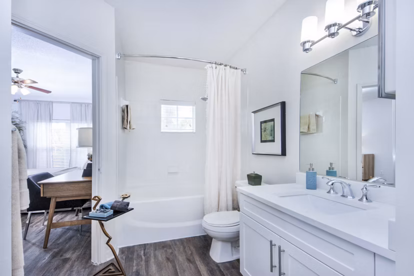 Cozy bedroom with modern dÃ©cor and natural light at Mira Flores Apartments