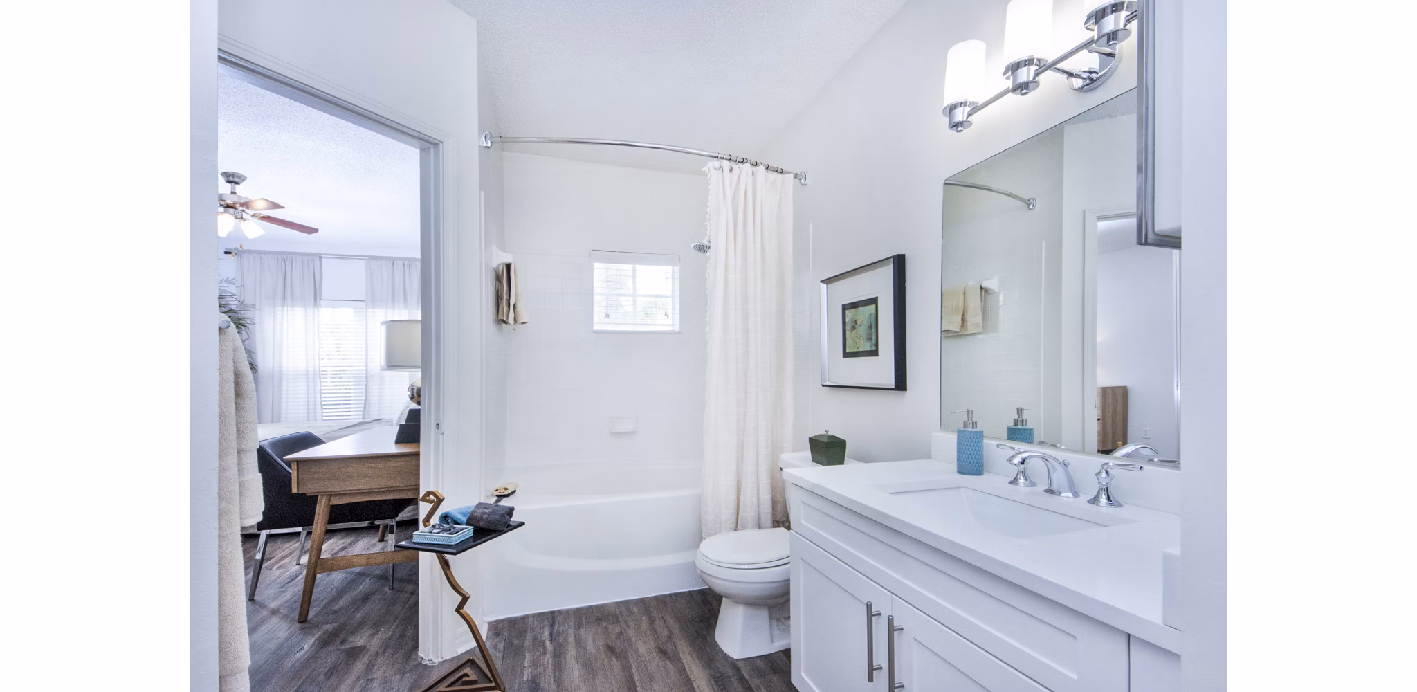 Cozy bedroom with modern dÃ©cor and natural light at Mira Flores Apartments