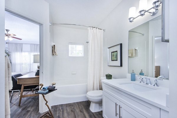 Cozy bedroom with modern dÃ©cor and natural light at Mira Flores Apartments