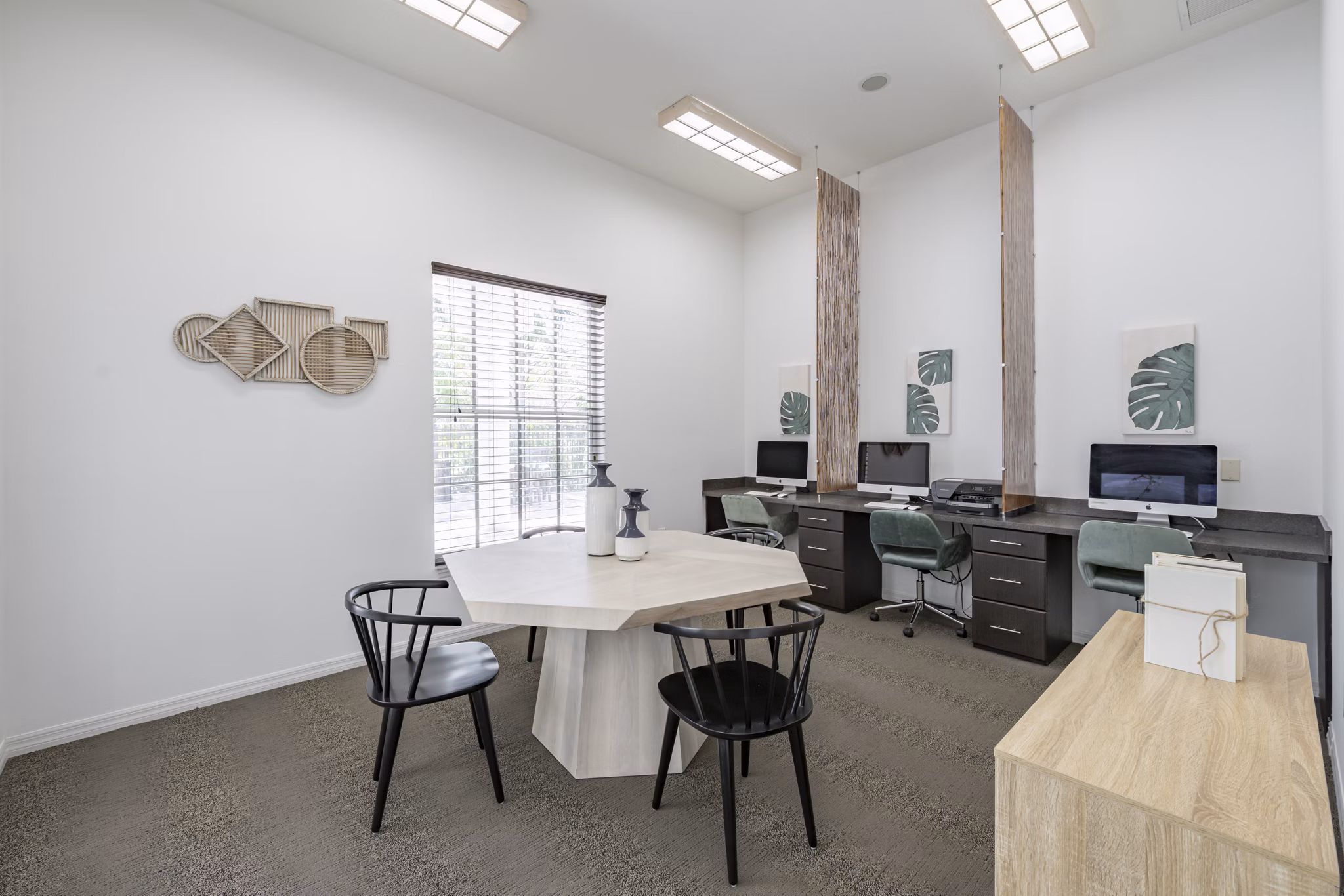 Business center with modern workstations at Mira Flores Apartments