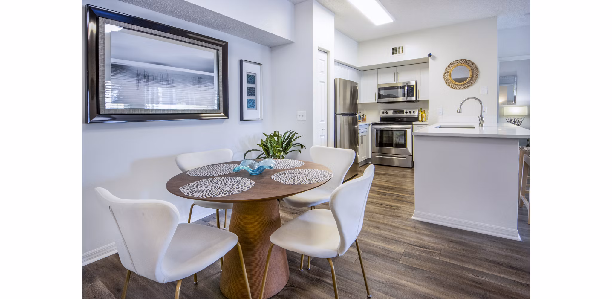 Mira Flores Apartments: Elegant dining room with designer lighting and modern furnishings, ideal for upscale living