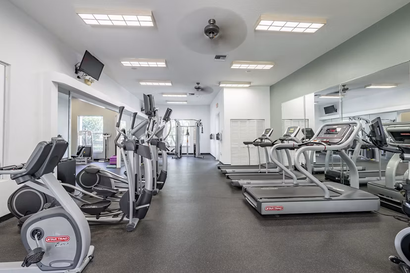 State-of-the-art fitness center with modern equipment at Mira Flores Apartments