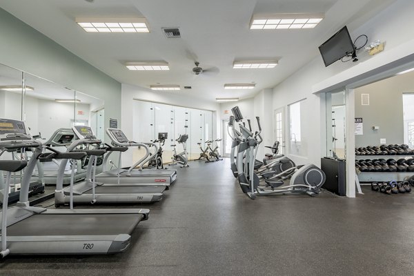 Modern fitness center with state-of-the-art equipment at Mira Flores Apartments