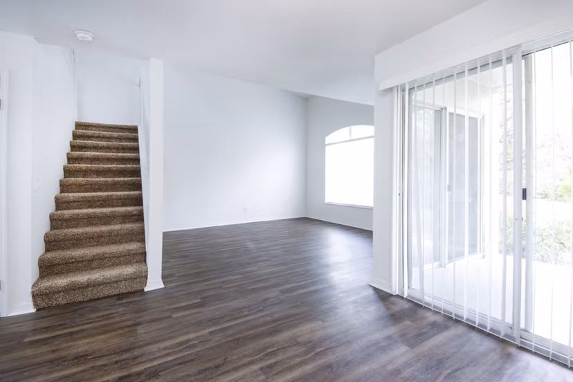 Spacious living room with contemporary decor in Mira Flores Apartments