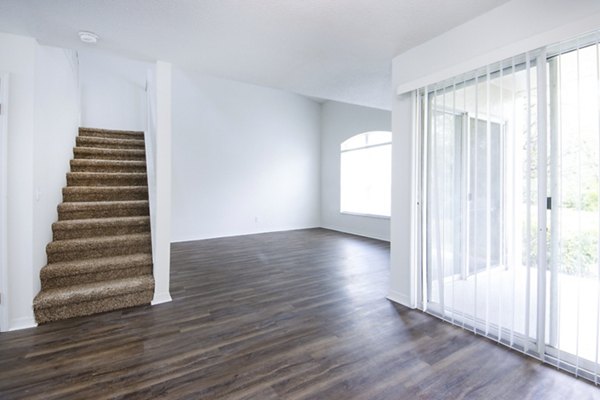 Spacious living room with contemporary decor in Mira Flores Apartments