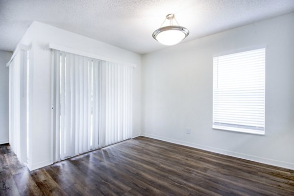 Spacious living room with modern decor at Mira Flores Apartments