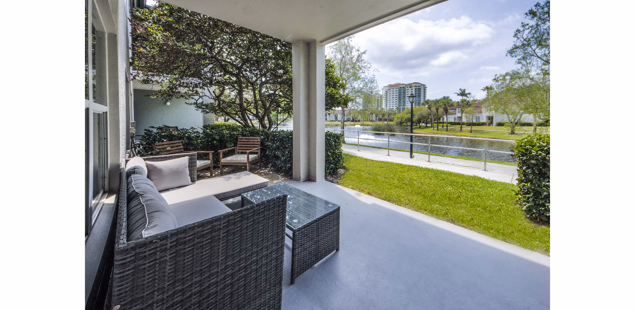 Patio space with outdoor seating at Mira Flores Apartments, featuring modern design and views