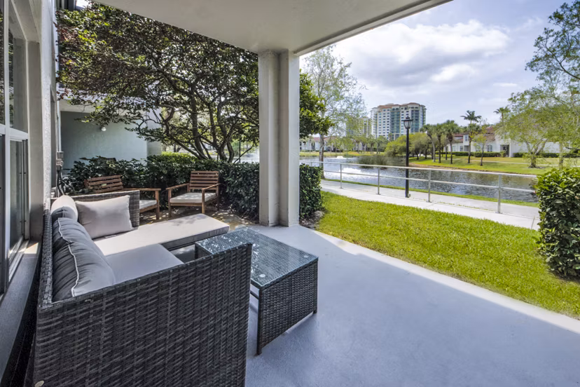 Patio space with outdoor seating at Mira Flores Apartments, featuring modern design and views