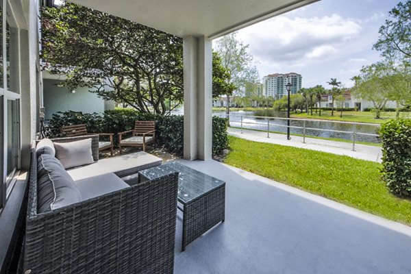 Patio space with outdoor seating at Mira Flores Apartments, featuring modern design and views