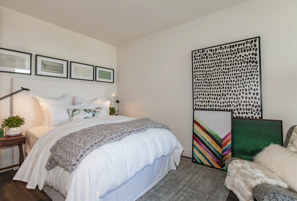 Bedroom featuring modern furnishings and stylish decor at The Dwight