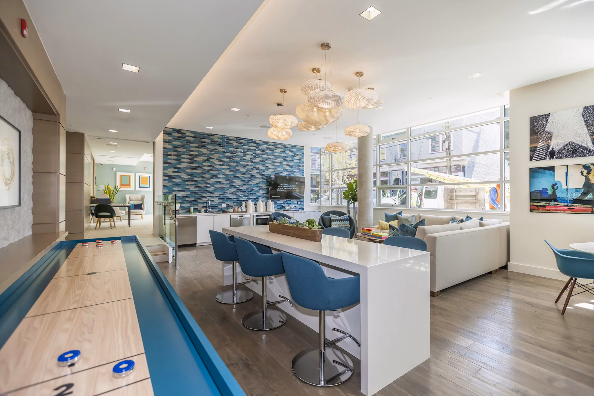Clubhouse featuring modern design and cozy seating at The Dwight luxury apartments