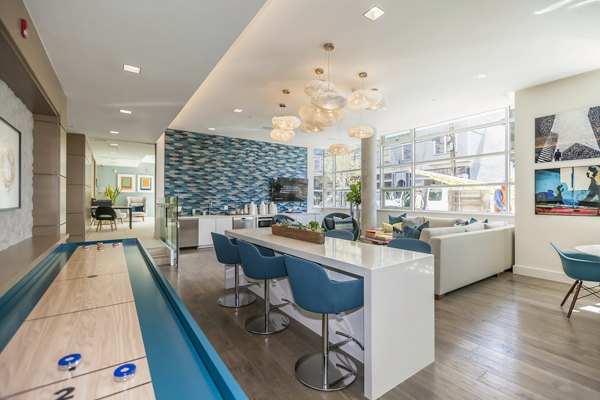 Clubhouse featuring modern design and cozy seating at The Dwight luxury apartments