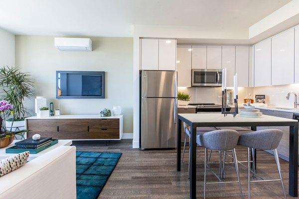 Spacious living room with plush seating and natural light at The Dwight luxury apartments