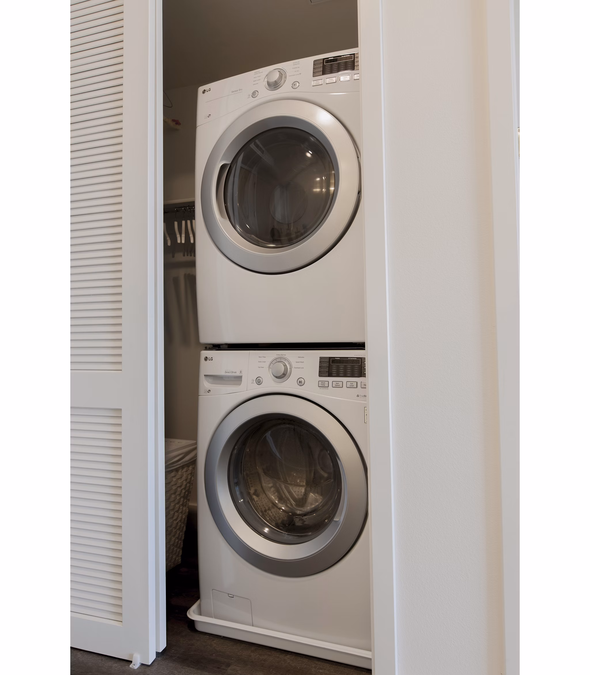 Modern laundry room with energy-efficient washers and dryers at The Dwight luxury apartments