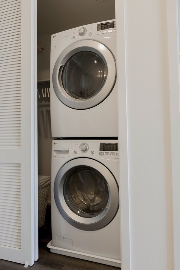 Modern laundry room with energy-efficient washers and dryers at The Dwight luxury apartments