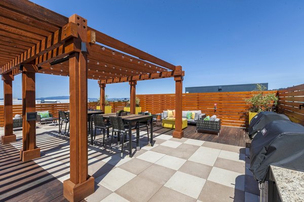 Outdoor grill area at The Dwight Apartments featuring modern BBQ setup for social gatherings
