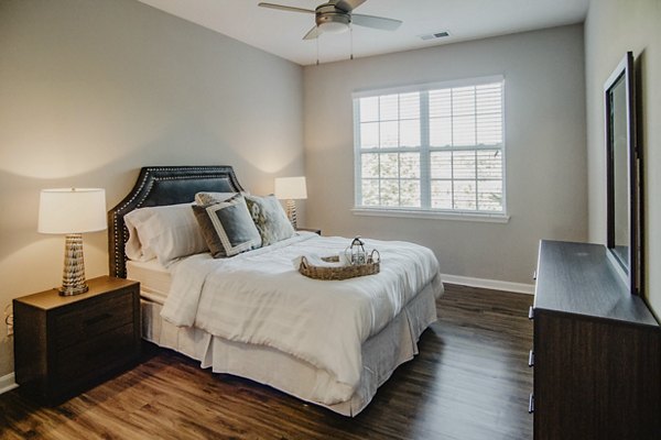 Cozy bedroom with modern design elements at Finley at Fairfax Corner luxury apartments