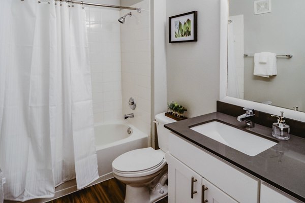 Contemporary bathroom with marble countertops at Finley at Fairfax Corner