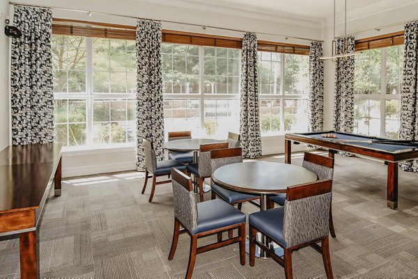 Clubhouse game room featuring billiards and lounge seating at Finley at Fairfax Corner luxury apartments