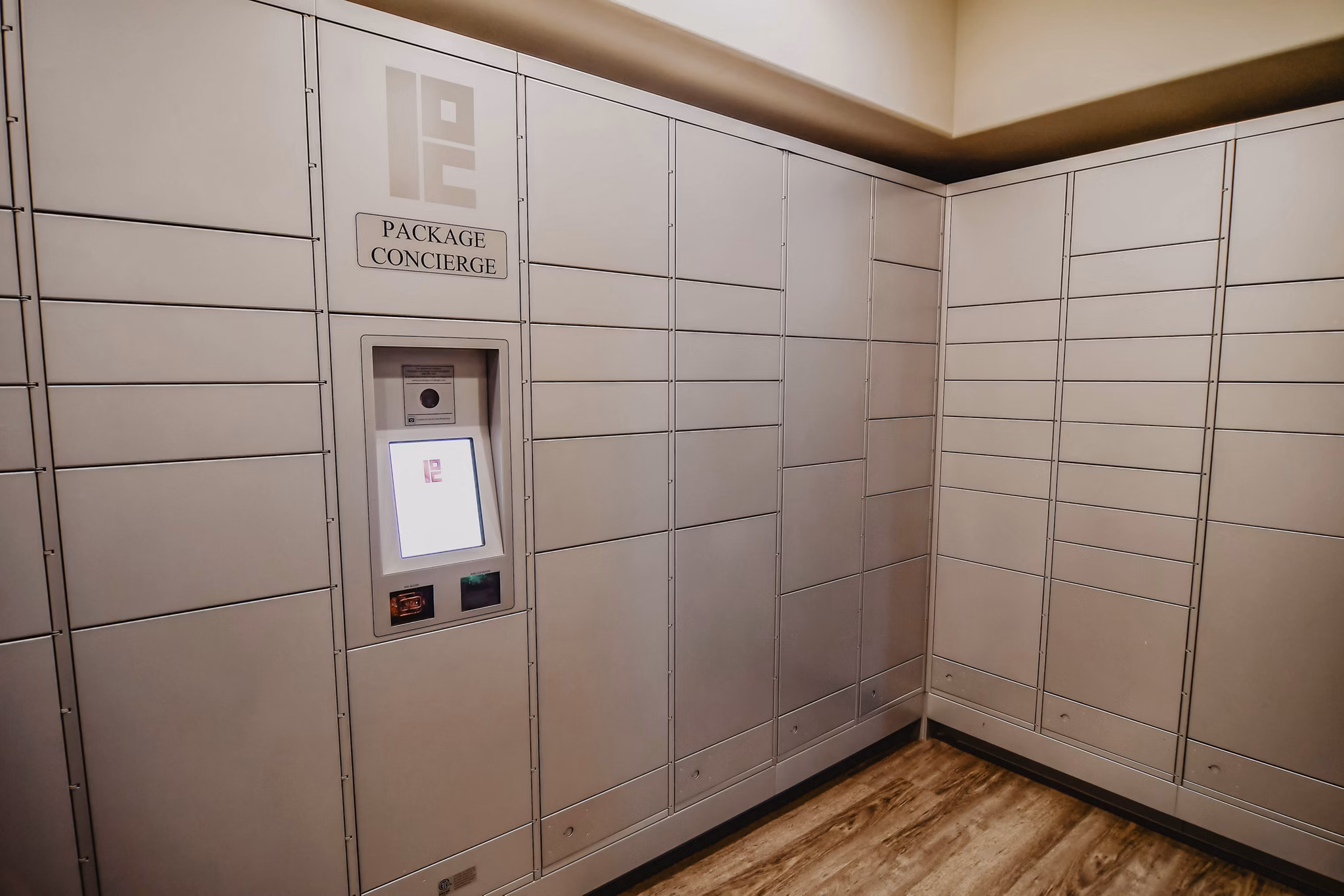 Secure parcel package pickup locker facility at Finley at Fairfax Corner luxury apartments in a modern residential community