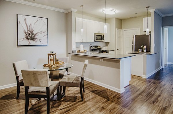 Elegant dining room with stylish furniture and pendant lighting at Finley at Fairfax Corner luxury apartments