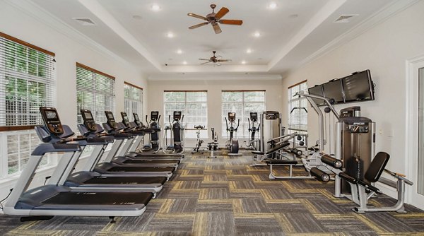 State-of-the-art fitness center with modern equipment at Finley at Fairfax Corner apartments