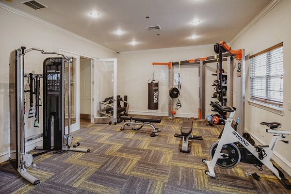 State-of-the-art fitness center with cardio machines and free weights at Finley at Fairfax Corner luxury apartments