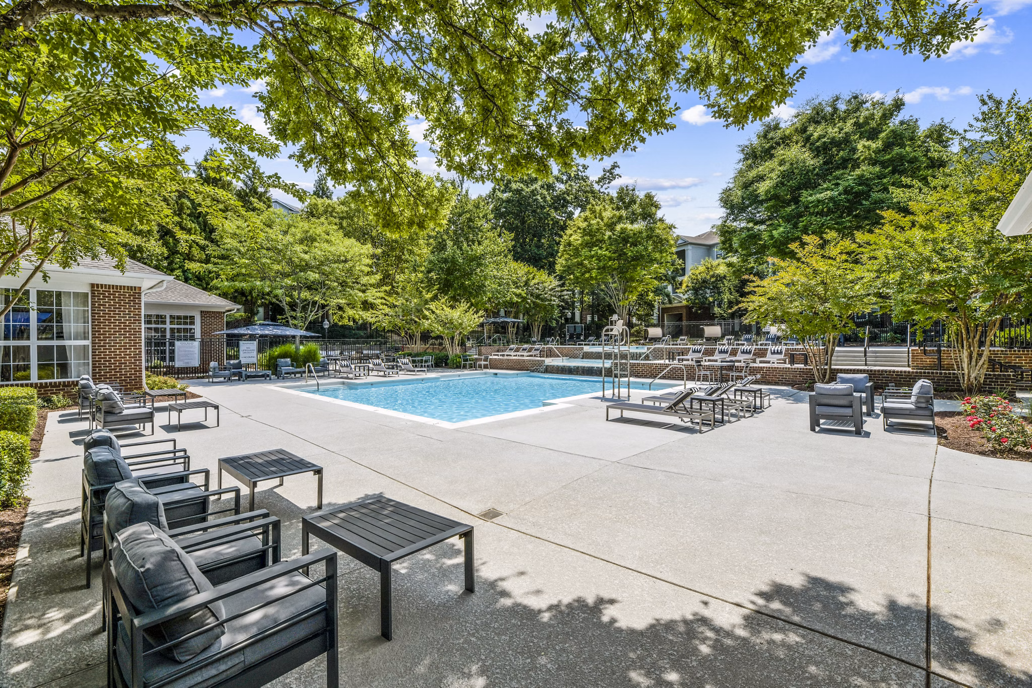 Infinity-edge swimming pool at Finley at Fairfax Corner Apartments offering luxurious relaxation and stunning views