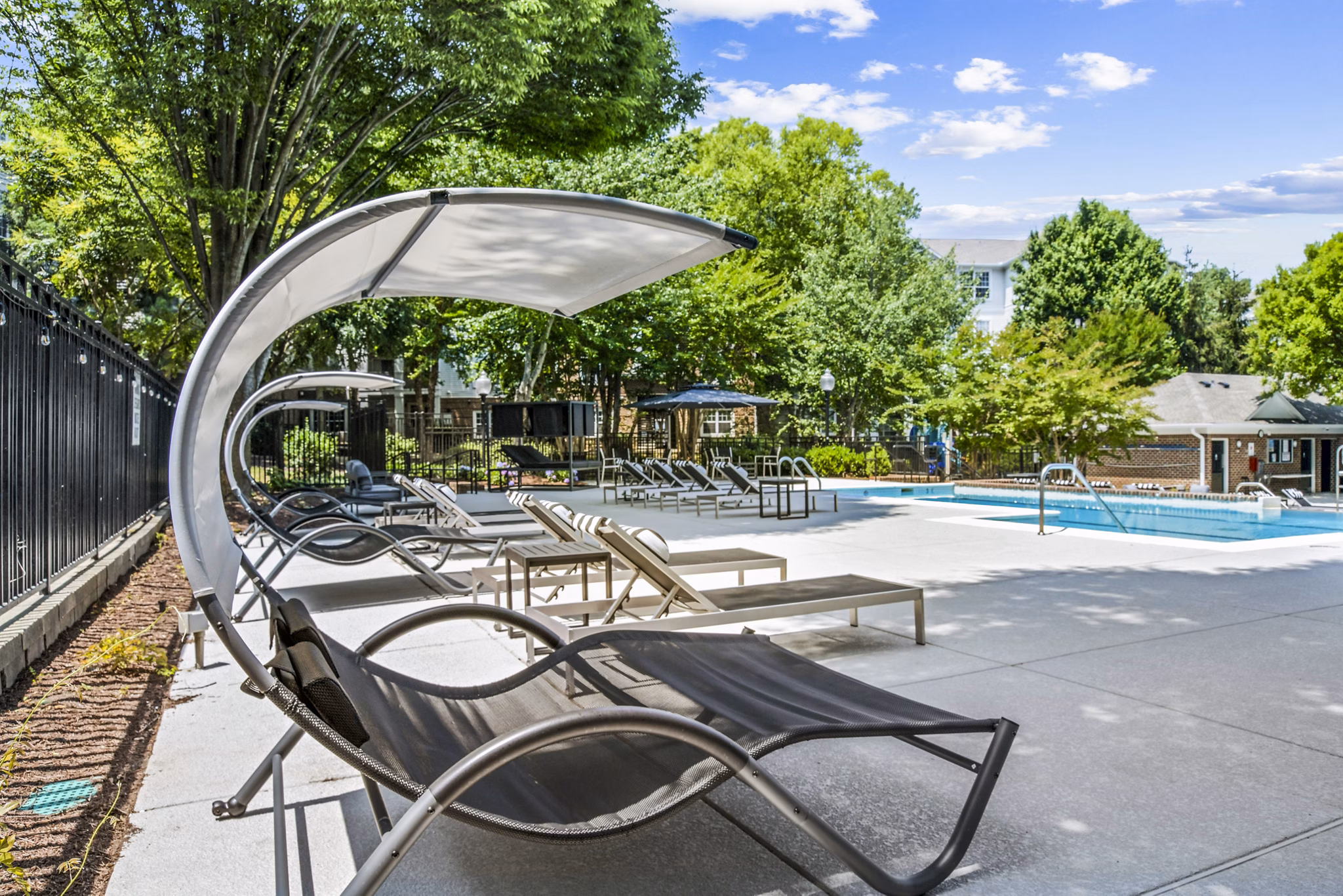 Resort-style outdoor pool area at Finley at Fairfax Corner Apartments