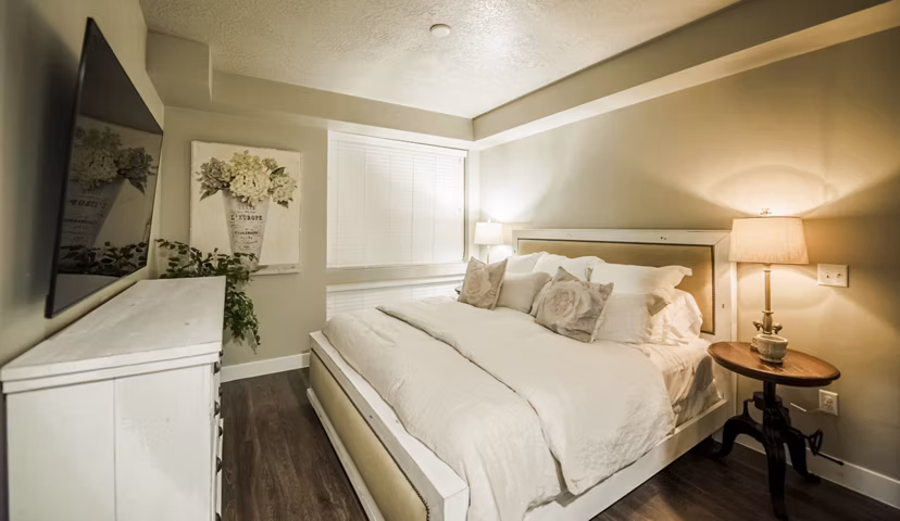 Cozy bedroom with modern decor at Hardware Village Apartments