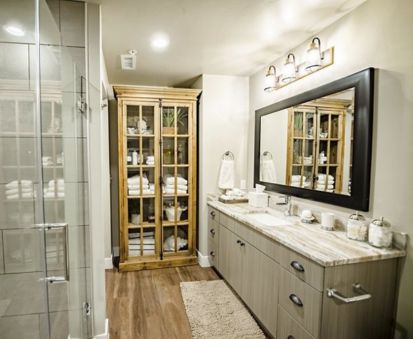 Bright bathroom featuring modern fixtures at Hardware Village Apartments