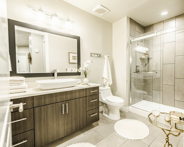 Elegant bathroom with modern fixtures at Hardware Village Apartments