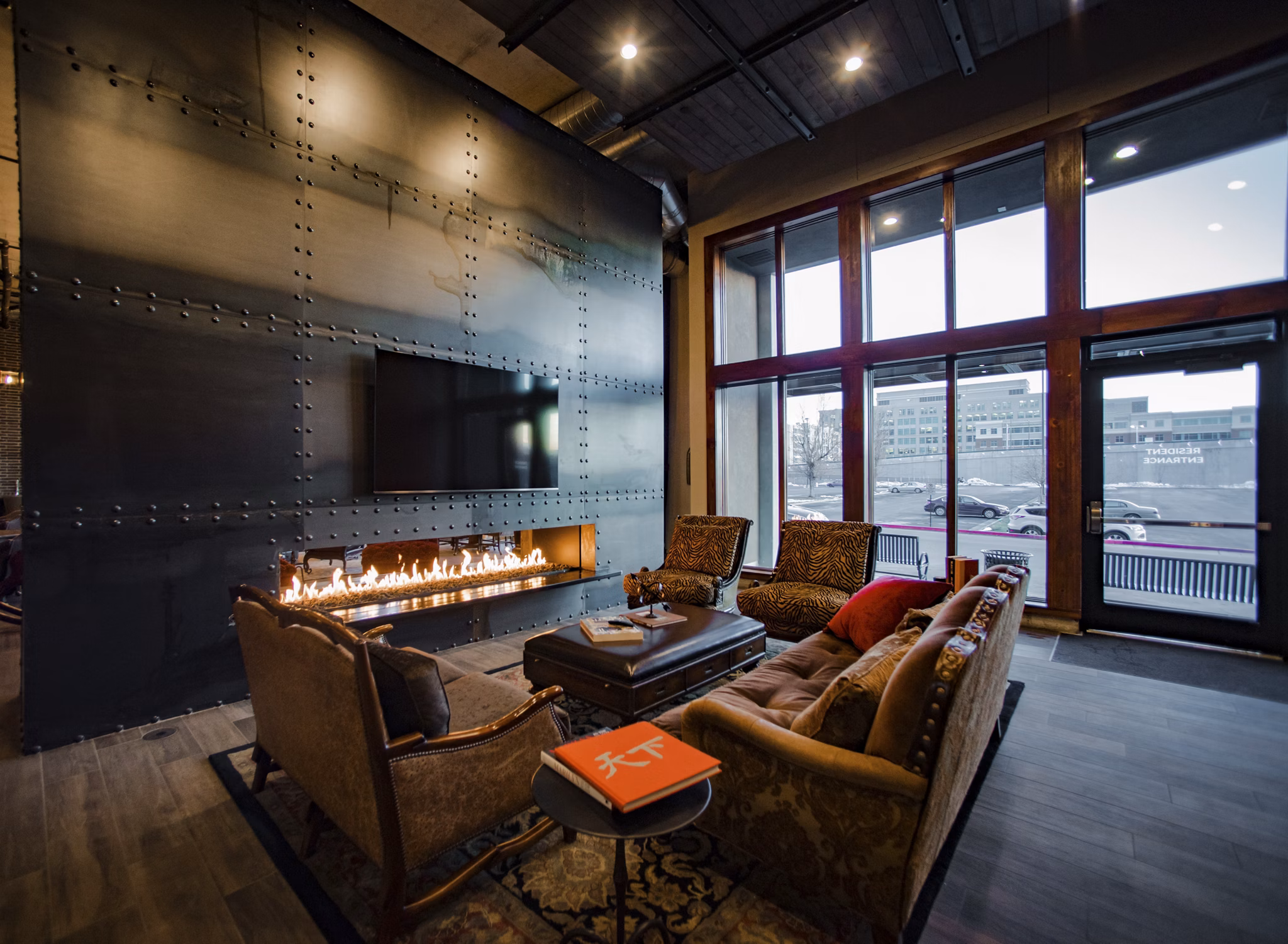Clubhouse with modern seating and contemporary decor at Hardware Village Apartments, offering luxury community space for residents
