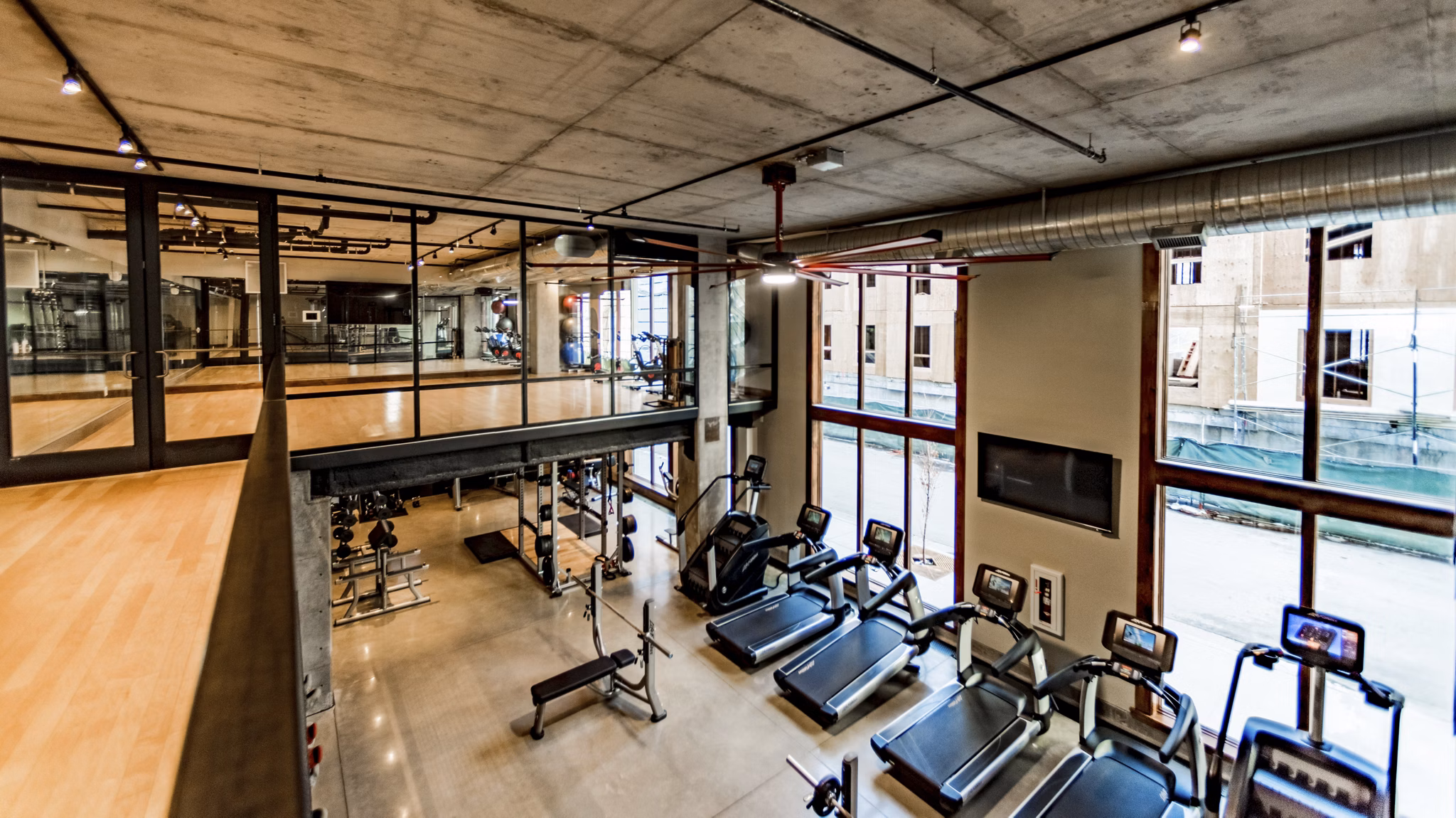 State-of-the-art fitness center with modern equipment at Hardware Village Apartments