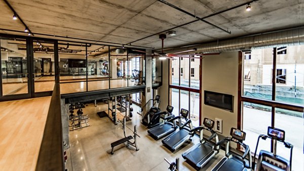 State-of-the-art fitness center with modern equipment at Hardware Village Apartments