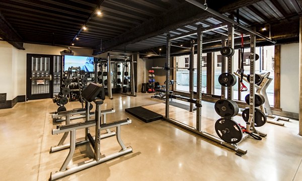Luxury gym with state-of-the-art fitness equipment at Hardware Village Apartments