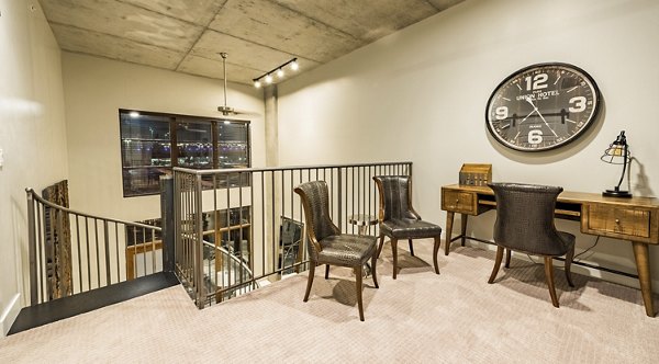 Contemporary kitchen with stainless steel appliances in Hardware Village Apartments