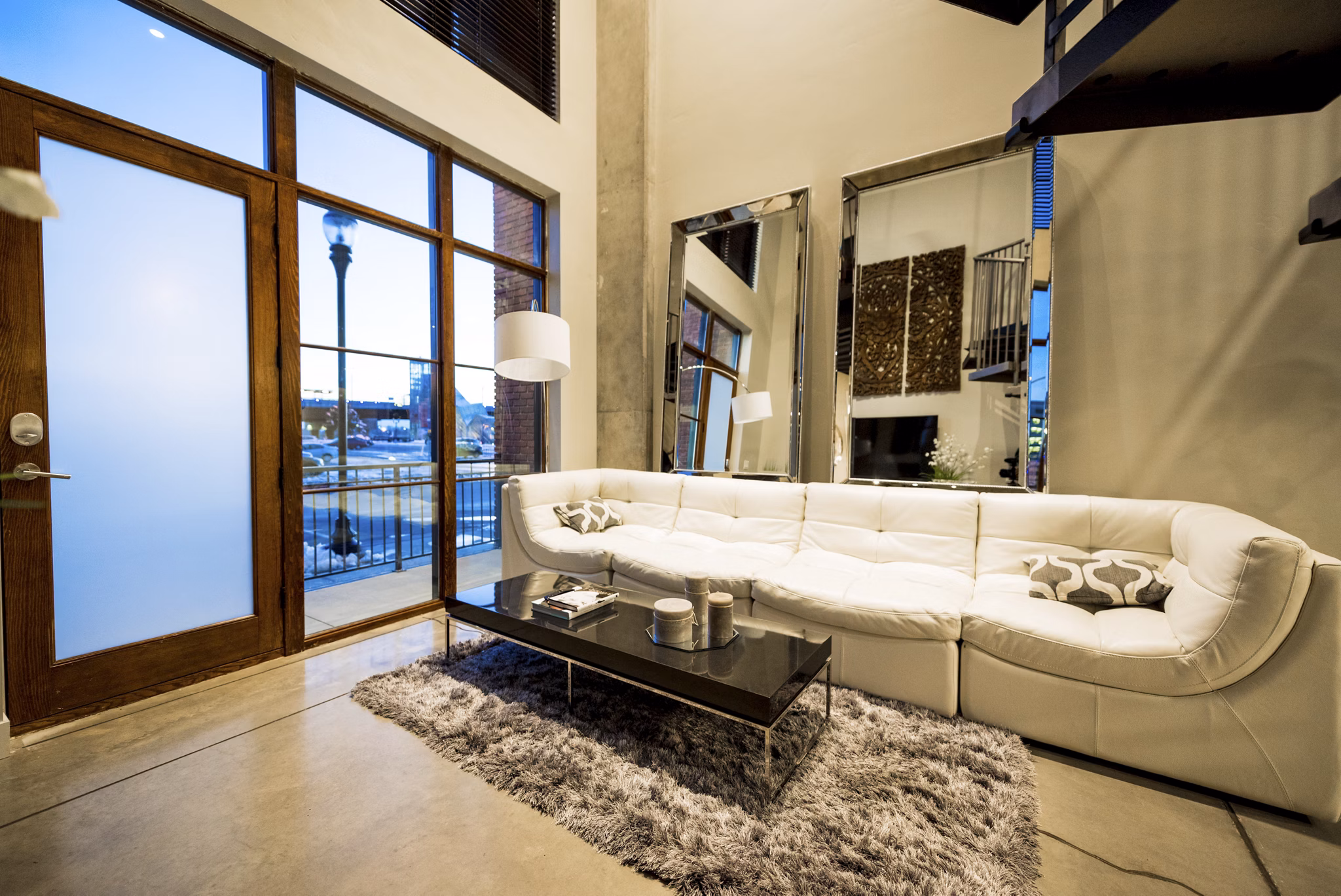 Modern living room with stylish decor at Hardware Village Apartments, featuring contemporary furniture and ample natural light