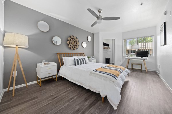 Cozy bedroom with elegant decor at Monterra Apartments in Fort Worth, TX, offers luxury living in a serene setting