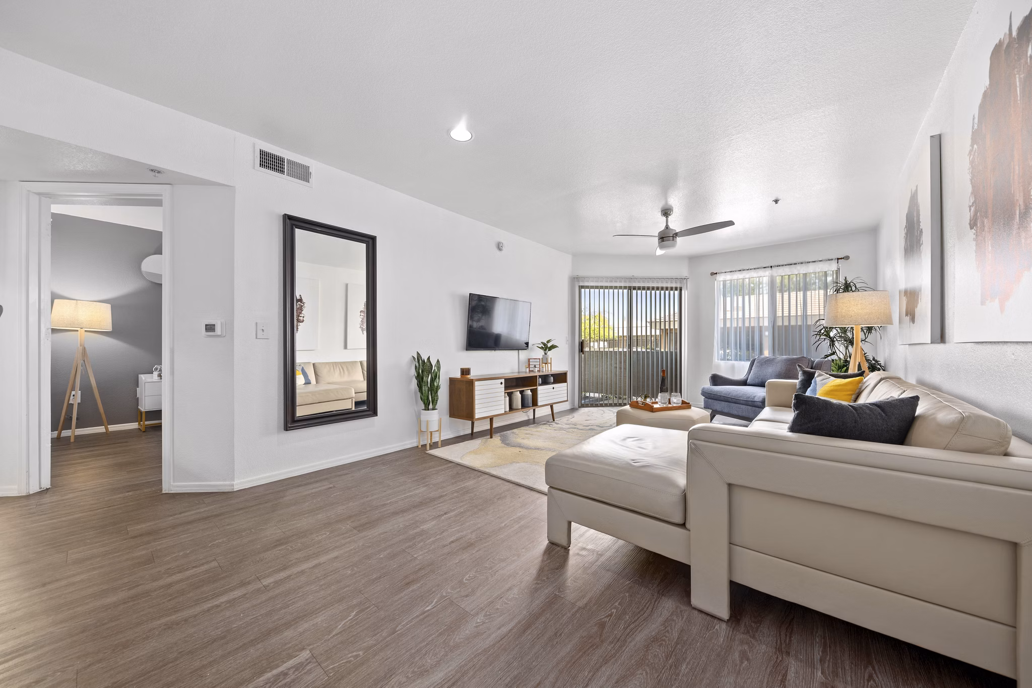 Elegant living room with modern decor and natural light at Monterra Apartments