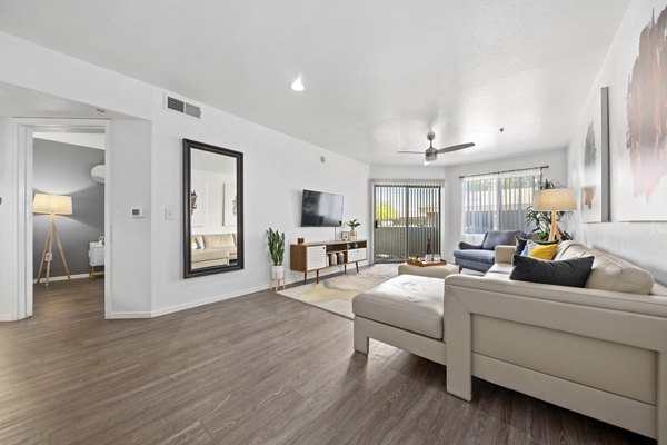 Elegant living room with modern decor and natural light at Monterra Apartments